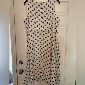 Dress, summery with cream lining both top and bottom. Elastic waist with belt.